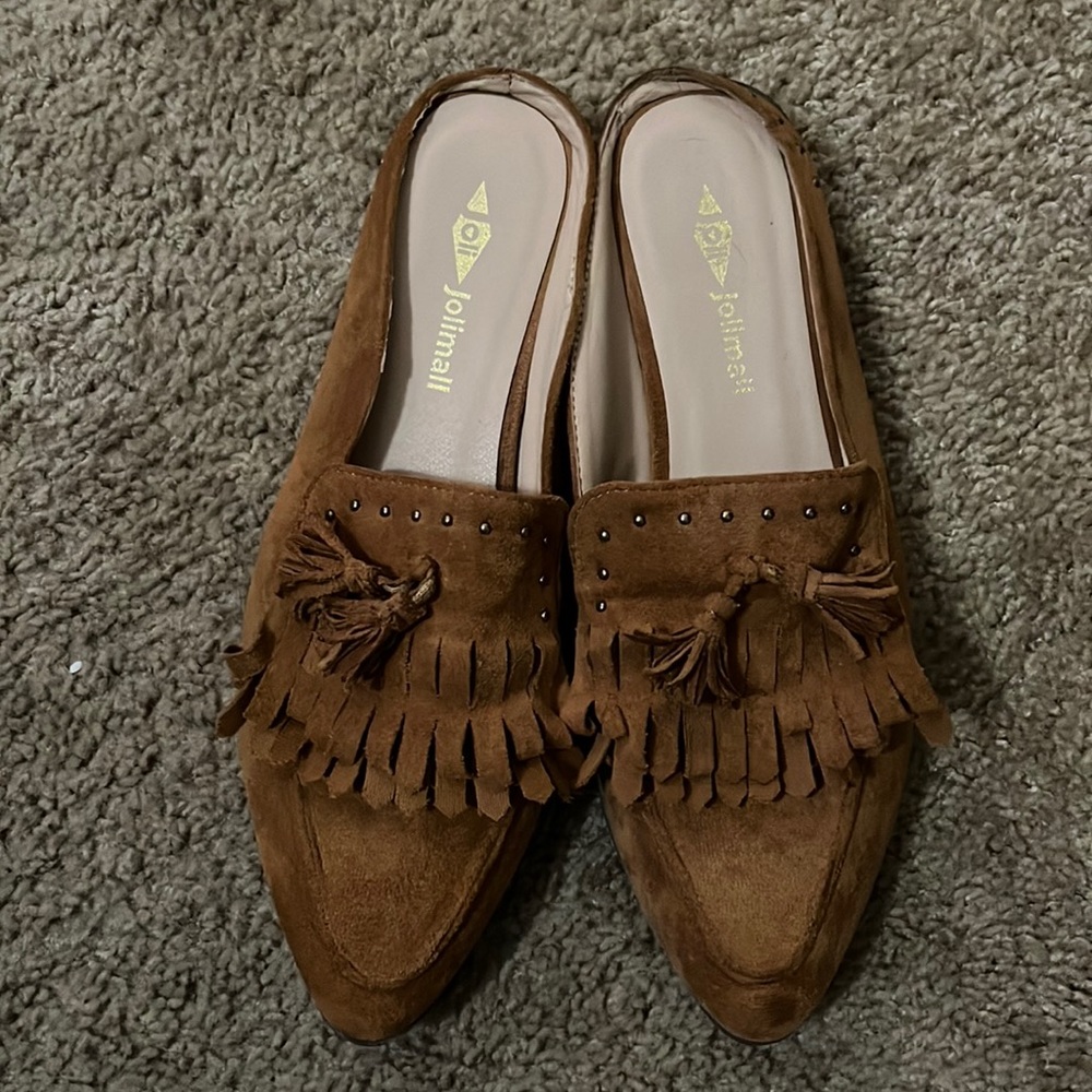 Brown suede flats with fringe details